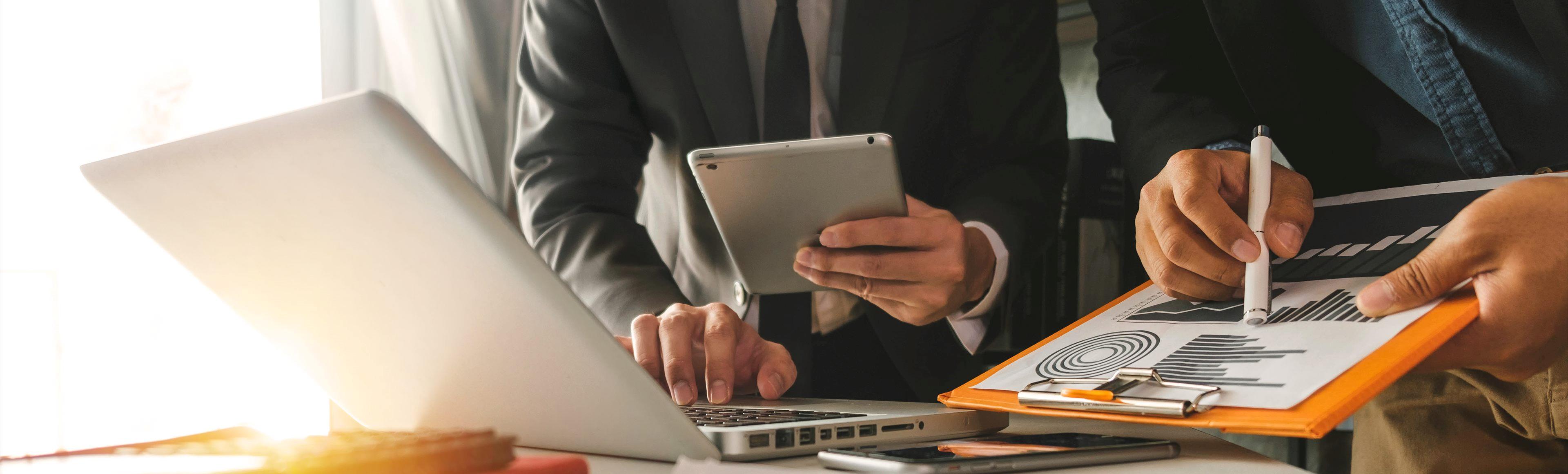 laptop and charts for analysis